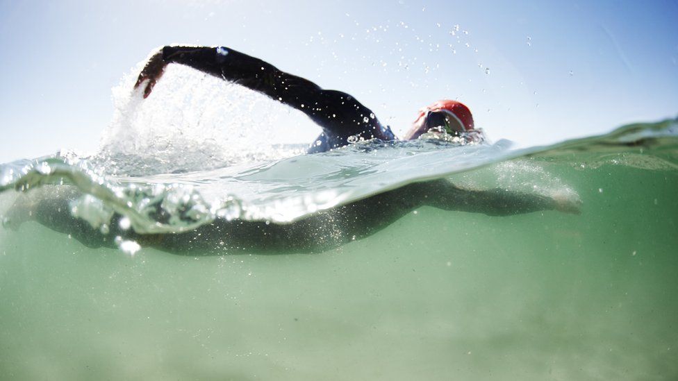 Man swimming in open water