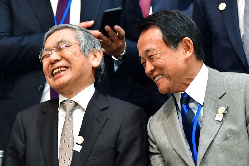 Haruhiko Kuroda (L), governor of the Bank of Japan, shocked global markets by adjusting policies on the government's 10-year bond yield. Photo by Kevin Dietsch/UPI | <a href="/News_Photos/lp/fbd37e82e52726f092d36f697afc58d0/" target="_blank">License Photo</a>