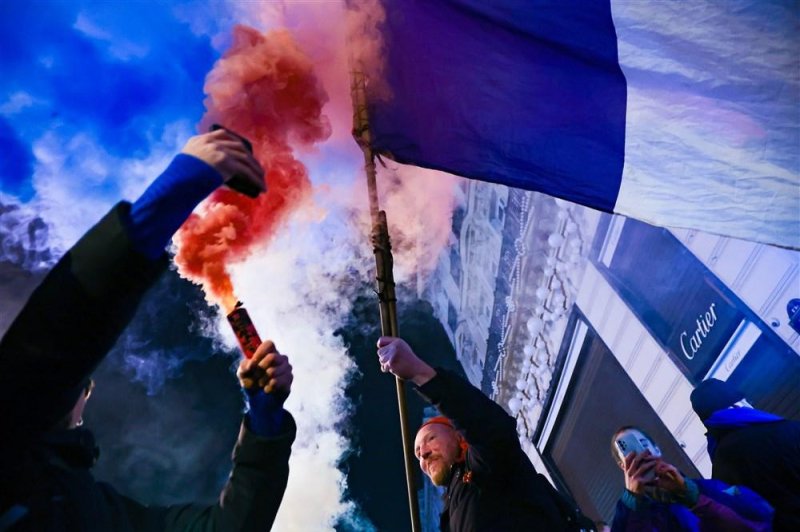 Fans light flares after France won the FIFA World Cup semifinal 2022 against Morocco on the Champs Elysees in Paris, France on Wednesday. Photo by Christophe Petit Tesson/EPA-EFE