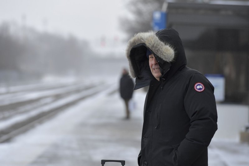 Travelers contend with the frigid cold temperatures hitting the Midwest and the Chicago area as they wait to board a commuter train heading to Chicago at the Naperville, Ill., Metra Station on Friday. Photo by Mark Black/UPI | <a href="/News_Photos/lp/054f452dca77d9a4d08a8dda24e12d71/" target="_blank">License Photo</a>