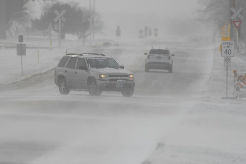 The 20-30 mph winds blow snow across Kautz Road in St. Charles, Ill., outside Chicago on Friday. Photo by Mark Black/UPI | <a href="/News_Photos/lp/c95131bce6b75876138d6d8f06bc990b/" target="_blank">License Photo</a>