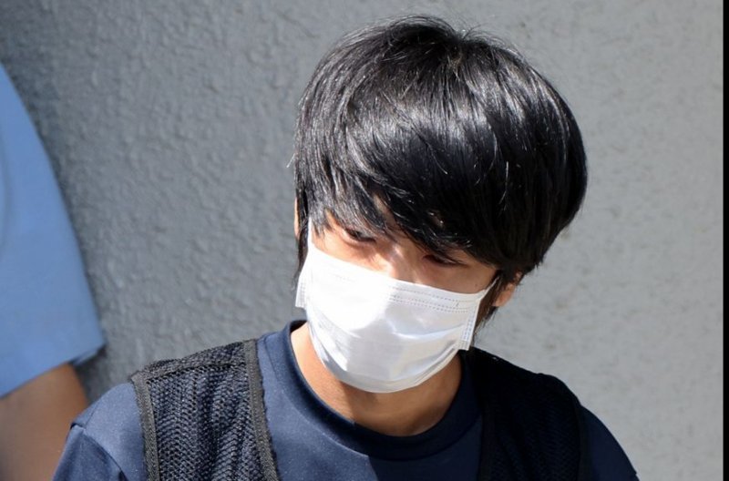 Tetsuya Yamagami, the 41-year-old man accused of killing Japanese former prime minister Shinzo Abe, leaves a police station in Nara, western Japan, on July 25. File Photo by Jiji Press/EPA-EFE