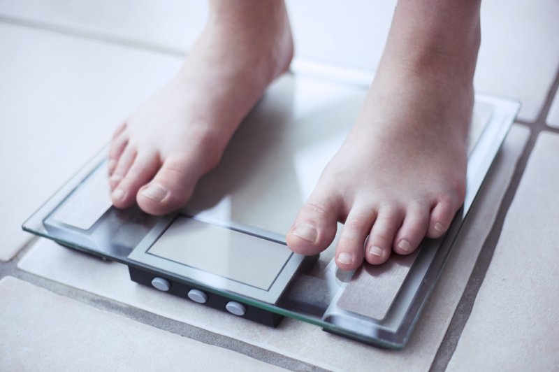 Certain patterns of weight gain and loss -- and corresponding changes in body mass index, or BMI -- may help predict a person's risk of developing dementia, a new study suggests. Photo by Tiago Zr/Shutterstock