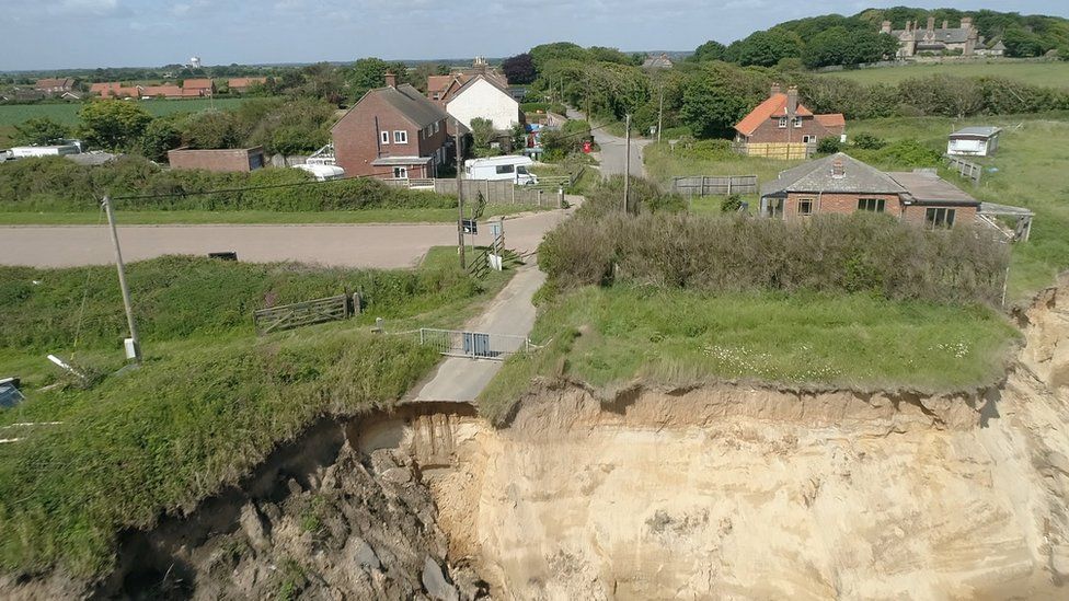 drone shot of cliff falling away