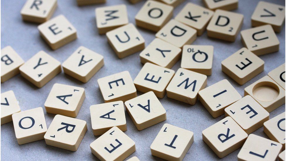 Scrabble letters in a jumble.