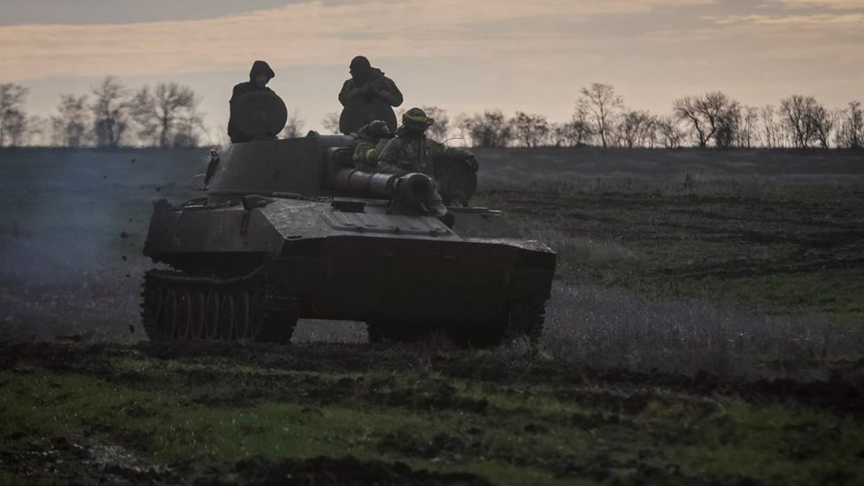 Ukrainian servicemen ride a self-propelled howitzer, amid Russia's attack on Ukraine, on a frontline in Donetsk region