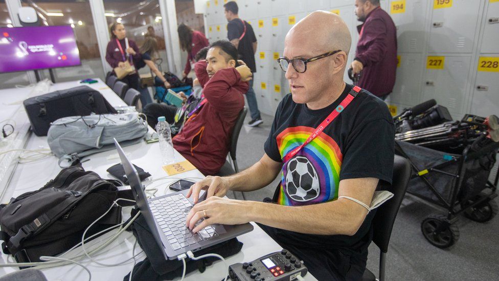 Grant Wahl works in the FIFA media centre in November