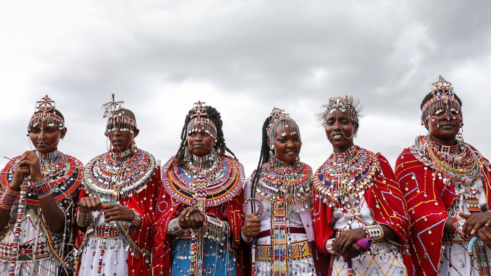 Maasai women wear their traditional attire to watch the games play out