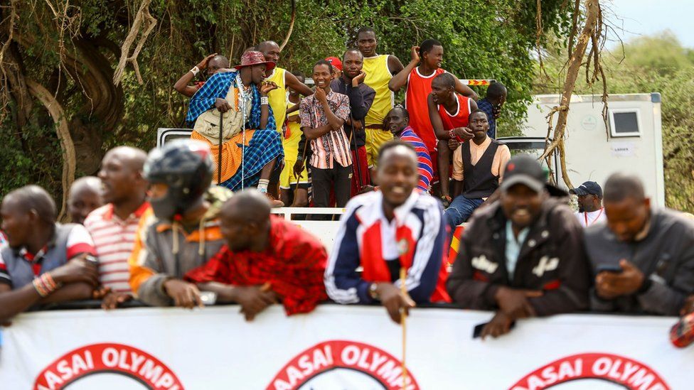 Maasai spectators watch the sporting event from afar