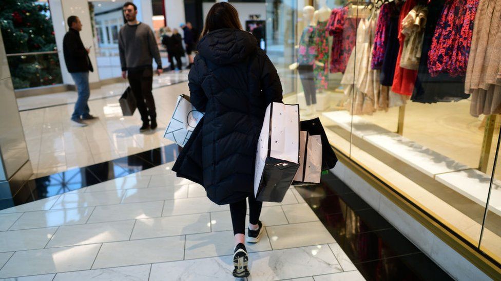 A woman with shopping bags