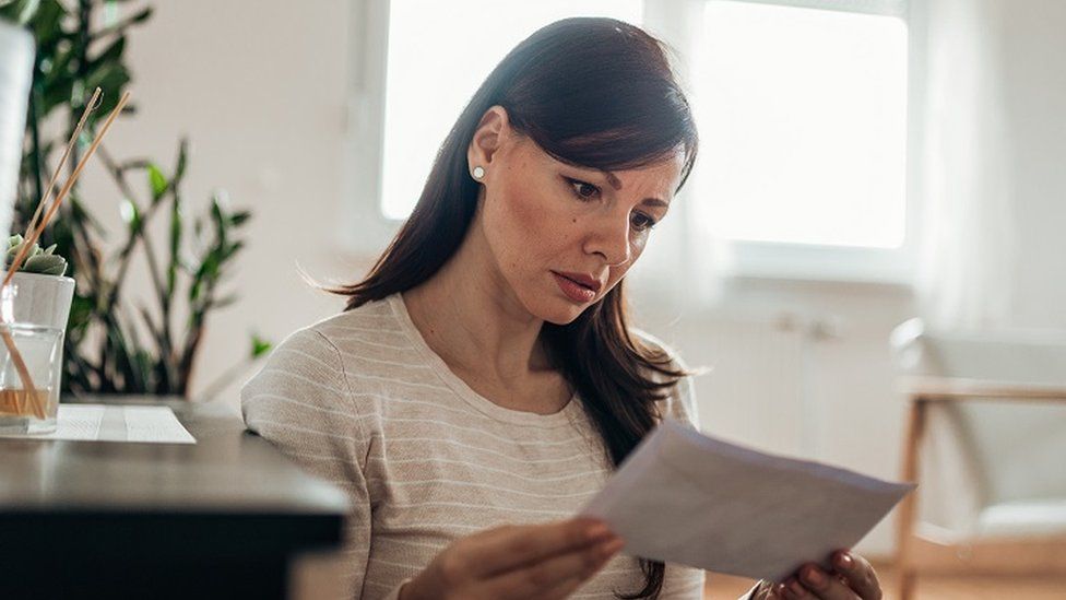 Woman reads letter