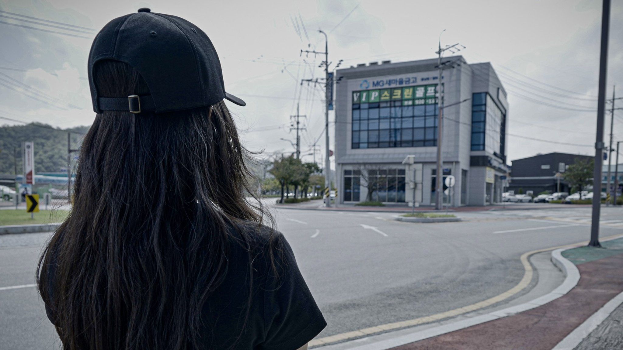 Yuna outside a bank