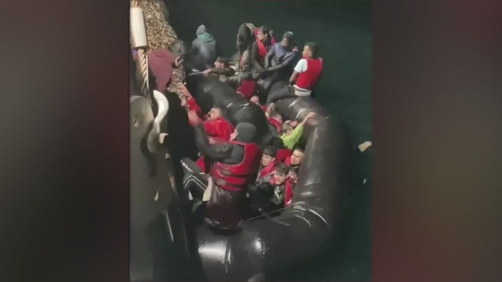 Footage from the rescue shows people struggling to escape from a sinking boat