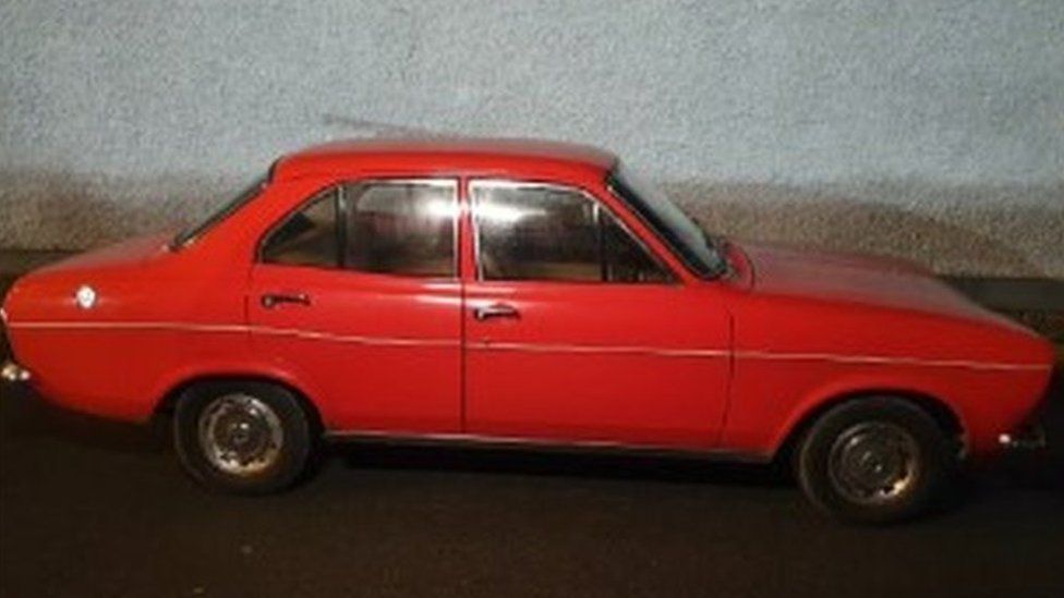 red Ford Escort