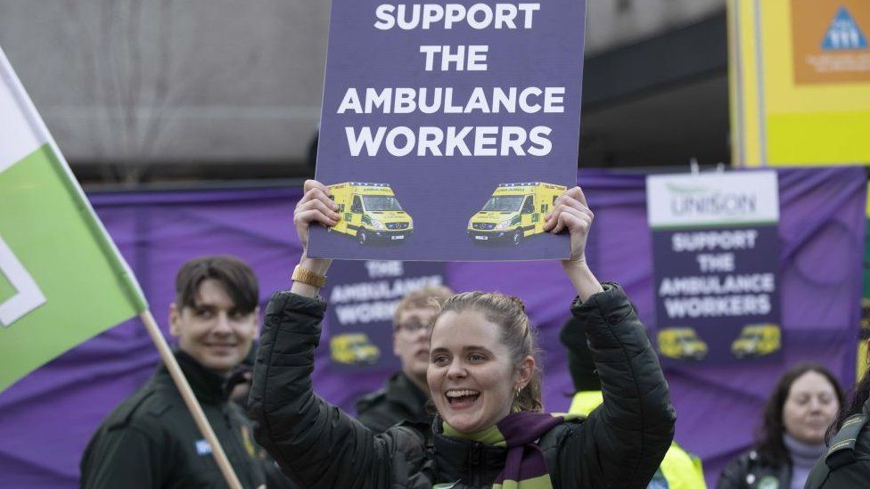 Striking ambulance worker on a picket line in London on Wednesday