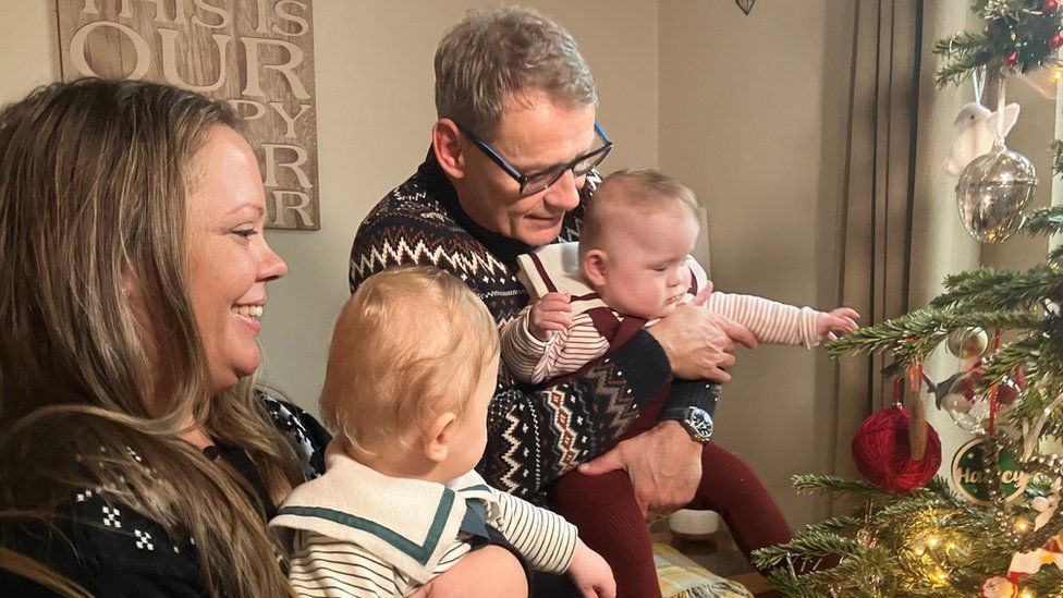 Family around the Christmas tree