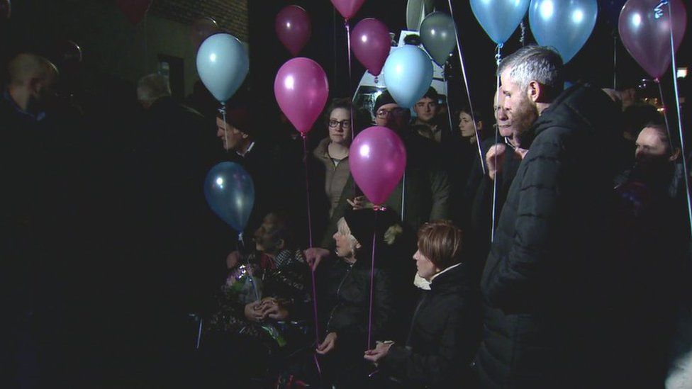 Pink and blue balloons were released into the air in memory of the expectant mother