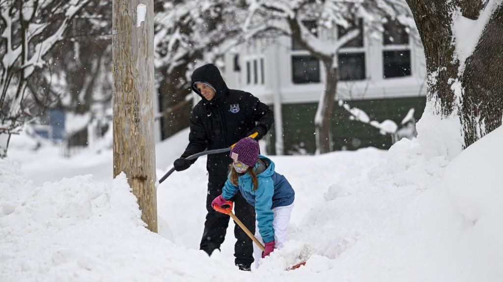 Man and child in the snow in Buffalo