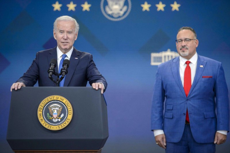 President Joe Biden and Education Secretary Miguel Cardona deliver an update on the student debt relief portal at the White House on October 17, 2022. The White House issued its opening brief to the Supreme Court on Wednesday. File Photo by Bonnie Cash/UPI | <a href="/News_Photos/lp/f76eb079089c7c69fc42366d1b426beb/" target="_blank">License Photo</a>