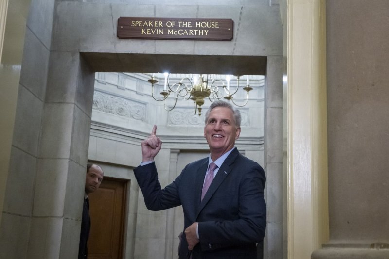 Rep. Kevin McCarthy, R-Calif., points to the sign above his new office after being elected Speaker in the House at the U.S. Capitol in Washington, D.C. on Saturday. Photo by Ken Cedeno/UPI