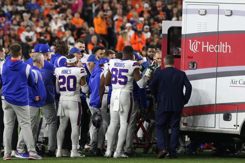 Buffalo Bills players surround their teammate Damar Hamlin (3) after he collapsed following a tackle against the Cincinnati Bengals during the first half of Monday Night Football play at Paycor Stadium in Cincinnati. Hamlin is in critical condition, according to the NFL. Photo by John Sommers II/UPI | <a href="/News_Photos/lp/9f1d624e36fd17804251fe62bc236e81/" target="_blank">License Photo</a>