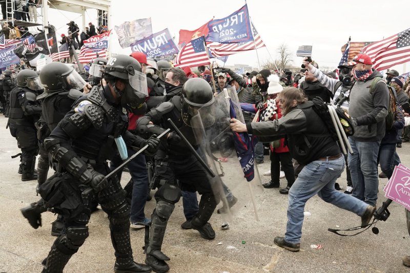 Mikhail Edward Slye of Meadville, Pa., allegedly tripped an officer who was attempting to assist another officer that was in the crowd on the north side of the Capitol during the Jan. 6, 2021, riot. File Photo by Ken Cedeno/UPI | <a href="/News_Photos/lp/95f5ec9e547eb5331bd881efcdd4dd02/" target="_blank">License Photo</a>