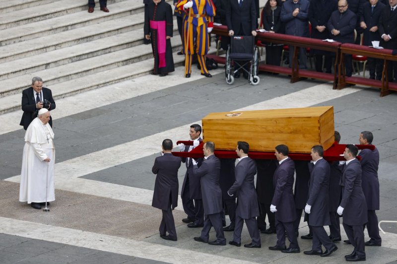 Pope Francis blesses the coffin carrying the body of Pope Emeritus Benedict XVI during the pontiff's funeral ceremony in Saint Peter's Square, in Vatican City on Thursday. Photo by Fabio Frustaci/EPA-EFE