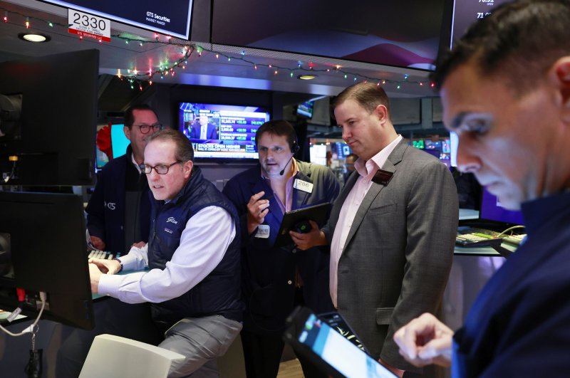 Traders work on the floor of the New York Stock Exchange on the first day of trading for 2023 on Wall Street in New York City. A rally Friday pushed all three major indexes to gains for the week. Photo by John Angelillo/UPI