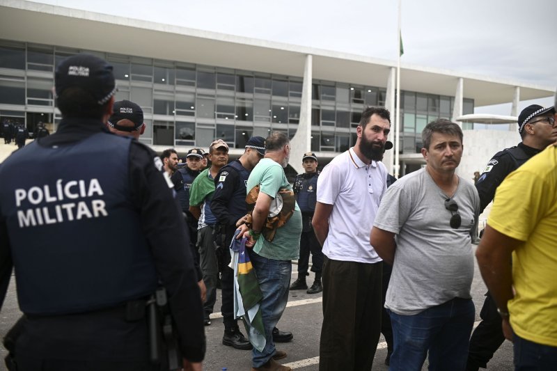 Security forces detain the supporters of former Brazilian President Jair Bolsonaro who invaded Planalto Palace, seat of the executive branch and the Supreme Court, in Brasilia, Brazil,on Sunday. Photo by Andre Borges/EPA-EFE