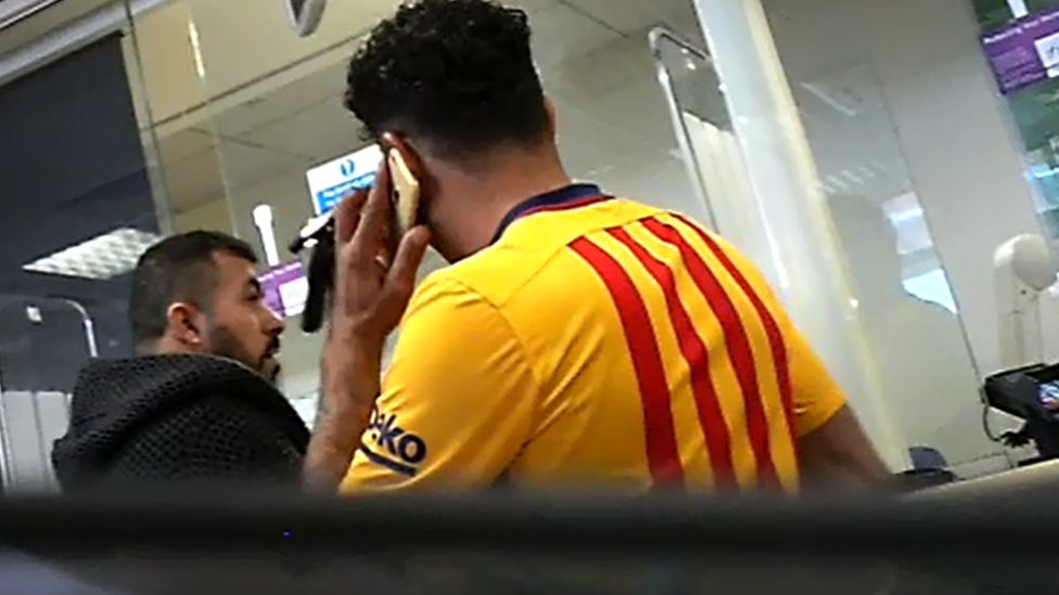 NAMIK and AHMED in a bank in Oldham