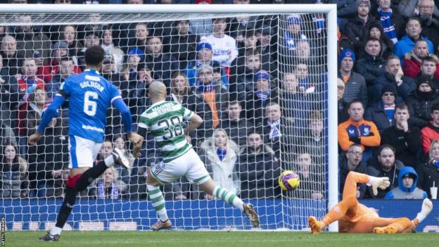 Daizen Maeda slots past Allan McGregor