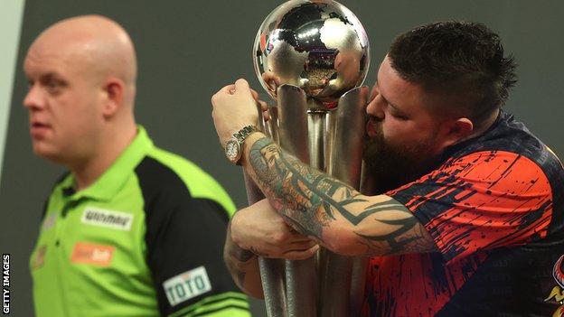 Michael Smith with the World Championship trophy