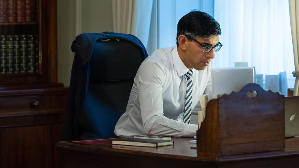 Rishi Sunak working at his desk