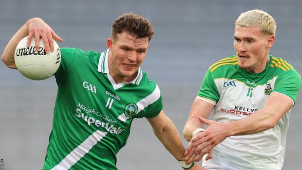 Glen's Jack Doherty challenges Moycullen's Owen Gallagher