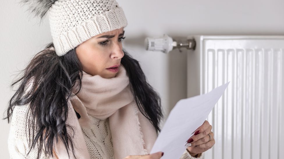 Woman looking at energy bill