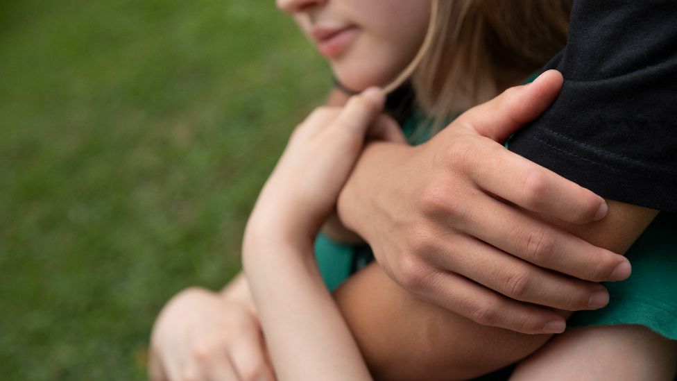 Teenagers hugging