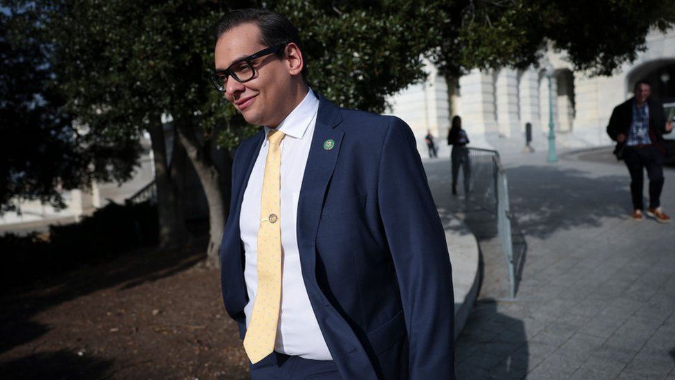 George Santos walks around the Capitol complex