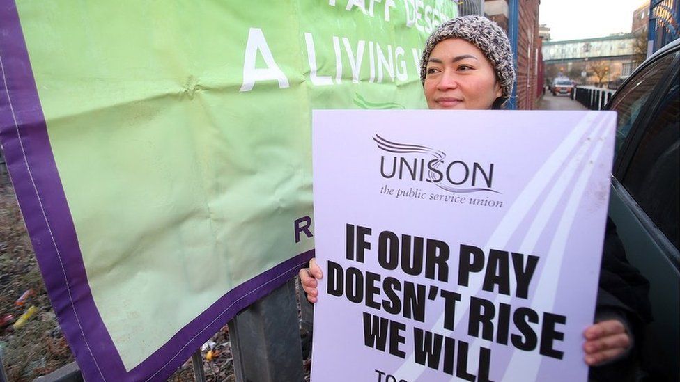 A health worker taking part in industrial action in December