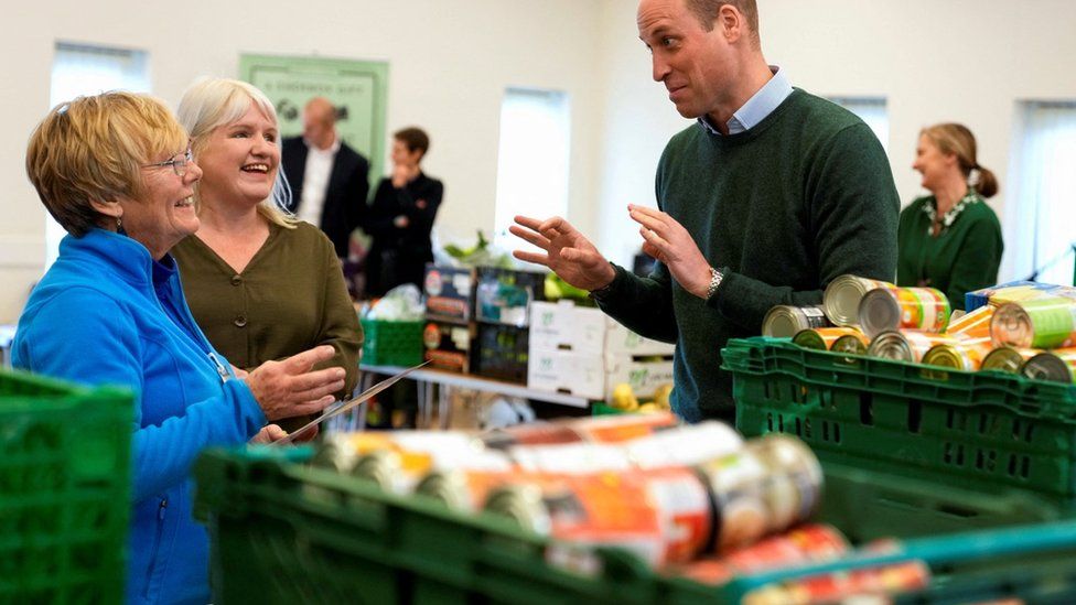 Prince William jokes with staff at Foodshare food bank in Windsor