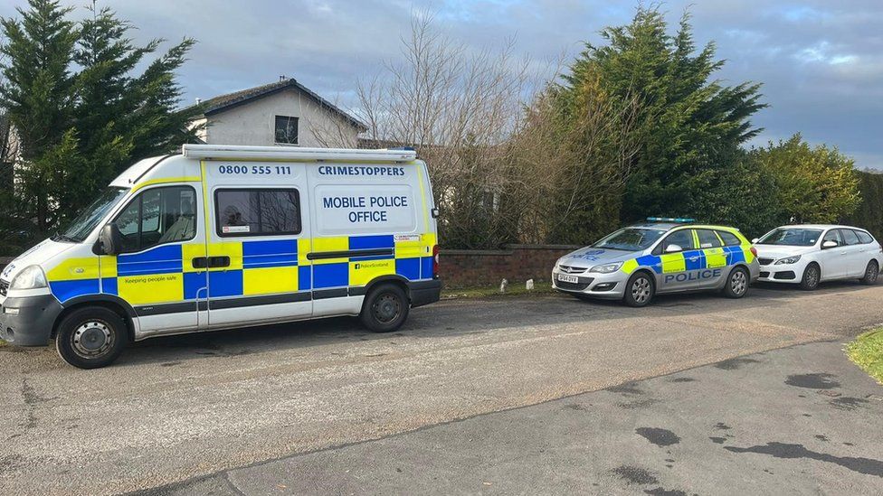 Police vans in Kippford