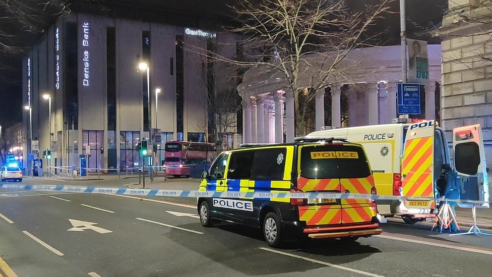 Police vehicles at the scene of the incident in Belfast city centre