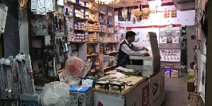 A photo of a Chinese owning an electrical shop