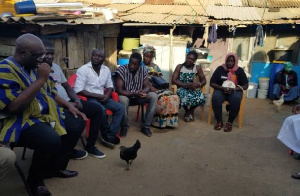 Joe Ghartey with the family of the late NDC youth organizer