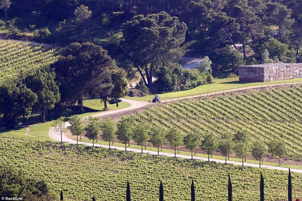 Idyllic: the pair could be seen taking in the lush surroundings near the luxury Villa La Coste boutique hotel where they were staying