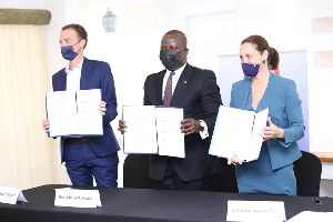 Samuel Jinapor (middle) flanked by the French Ambassador and an official of the Embassy