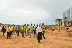 MPs being taken on a tour round Empire Cement by Nana Obokomatta IX (Right)