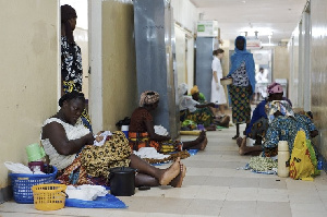 File photo of some pregnant women and mothers and their babies being treated on the floor