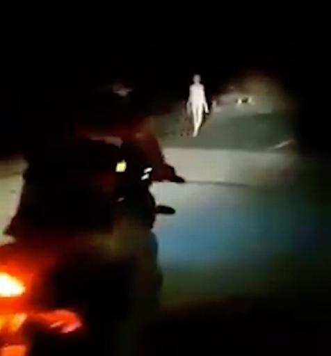 'Alien' figure with long limbs seen walking along bridge in the middle of the night