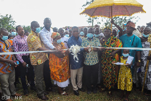 George Mireku Duker joined by elders of the community to cut the sod