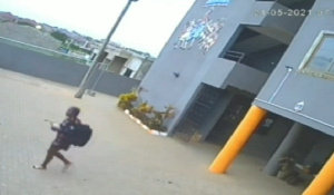 A photo of Natashia in the deceased's outfit walking out of the hotel premises